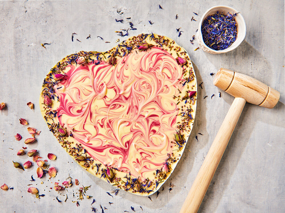 Chocolate heart with edible flowers