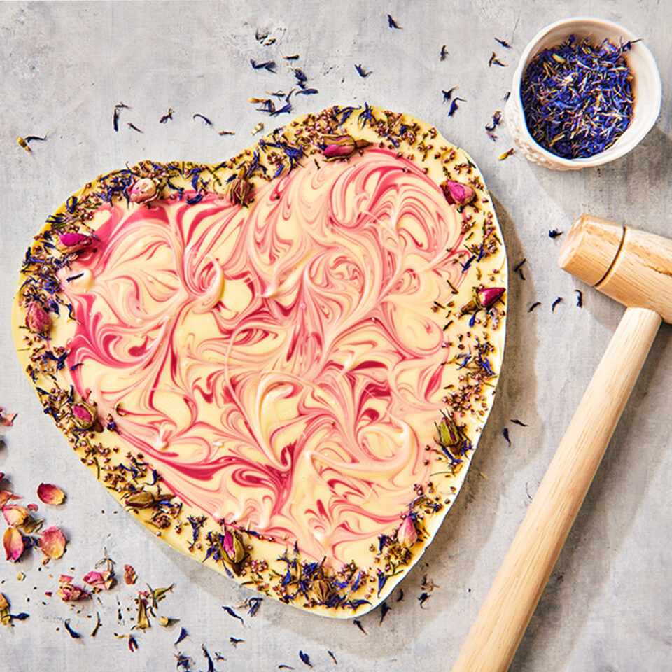 Chocolate heart with edible flowers