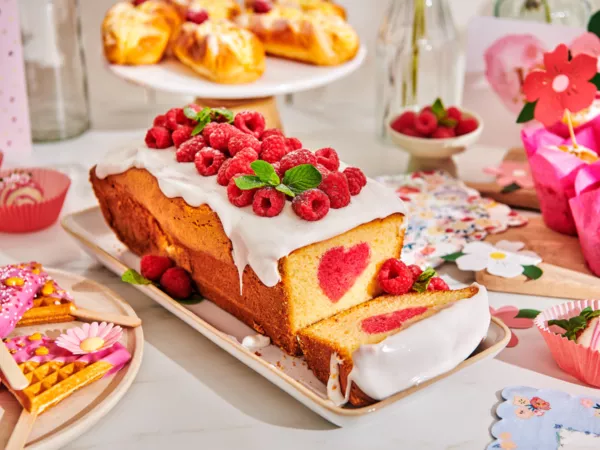 Classic Cake with pink heart and raspberries